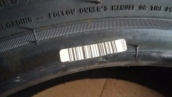 今新买二支米其林轮胎,不知条码傍的字母,数字